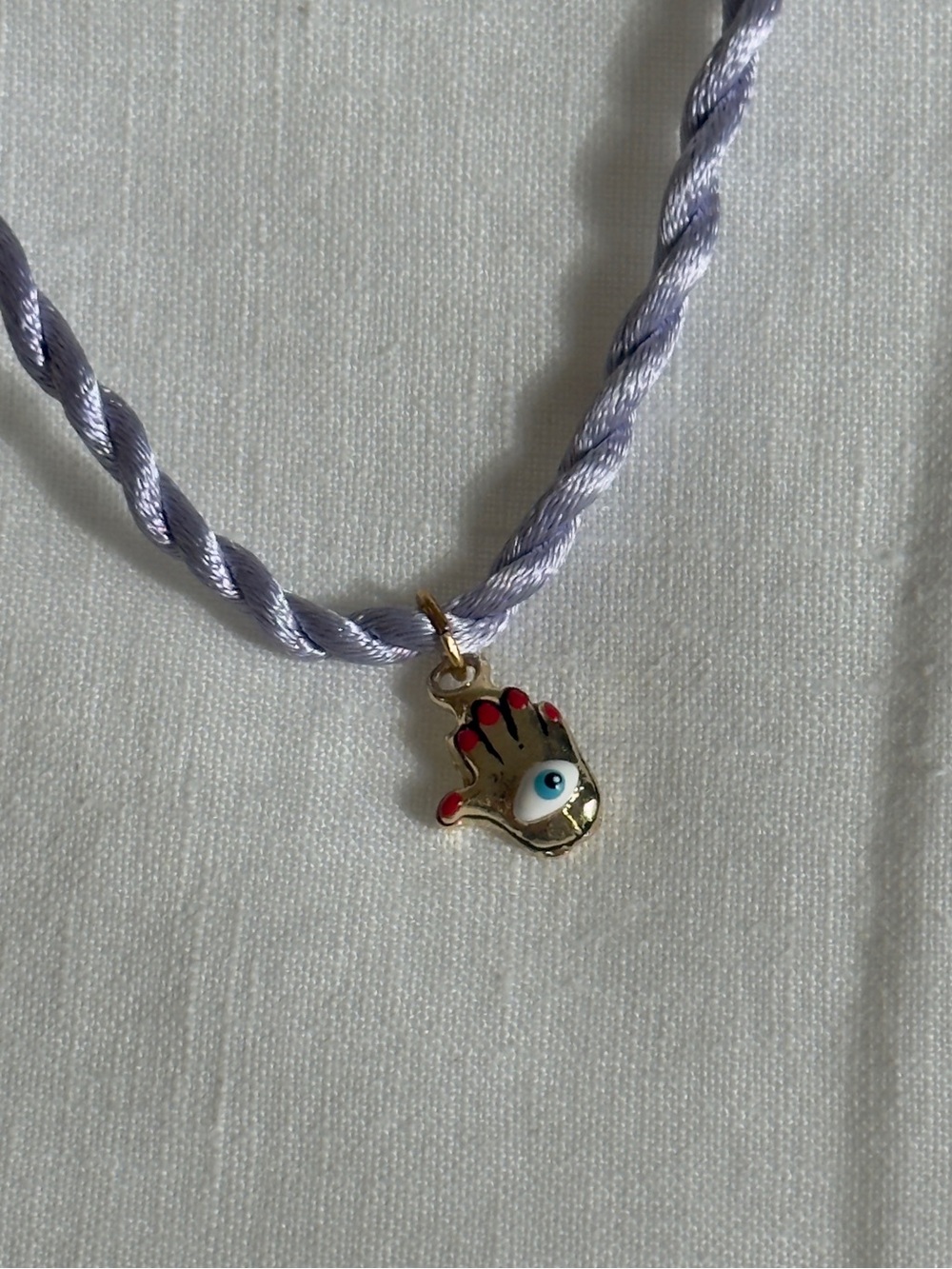 Susan Alexandra Tiny Joys Lilac Cord Necklace with Gold Hamsa Eye Charm